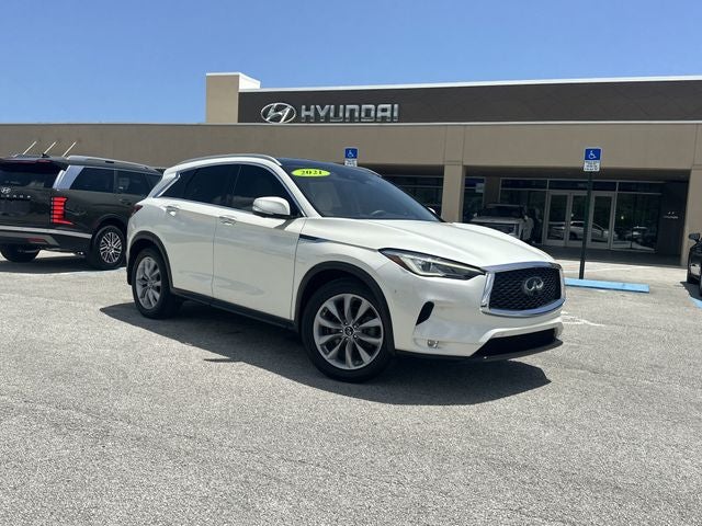 2021 INFINITI QX50 ESSENTIAL in Majestic White — front three-quarter view