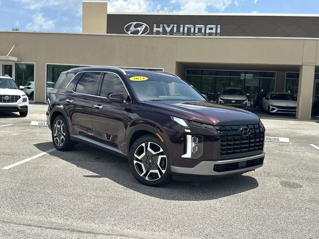 2024 Hyundai Palisade Limited in Sierra Burgundy — front three-quarter view
