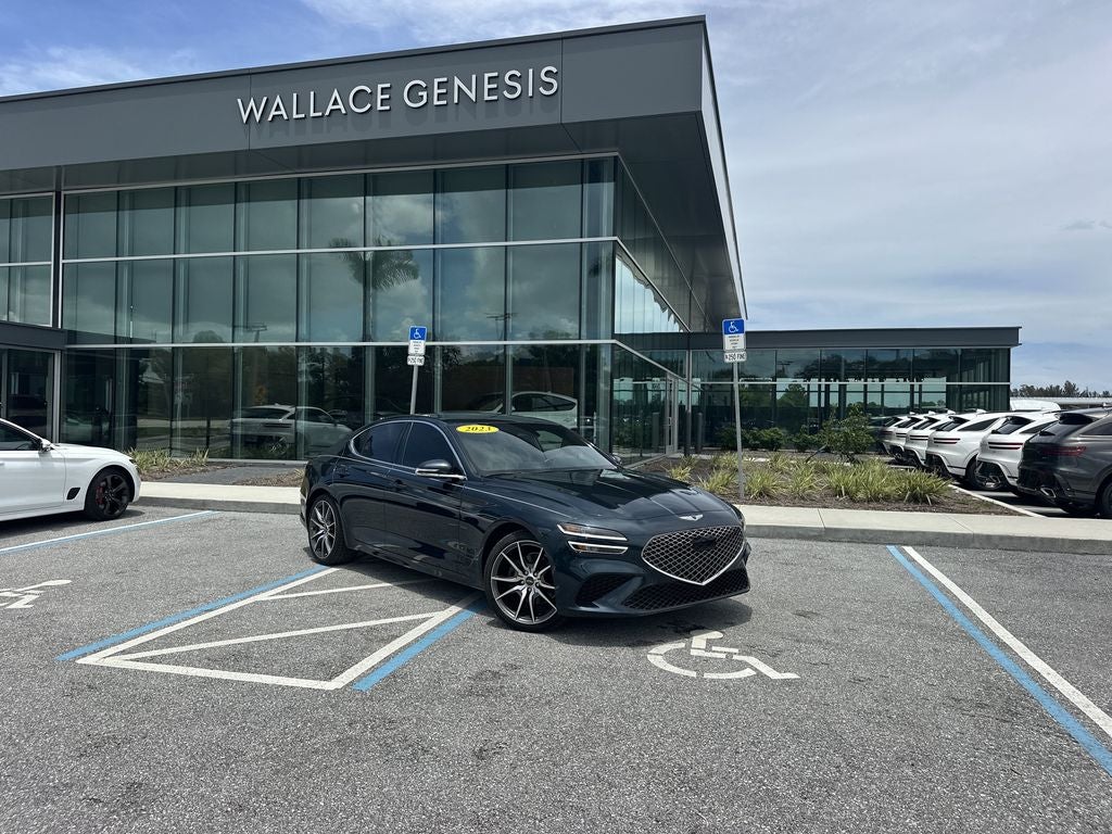 2023 Genesis G70 2.0T in Tasman Blue — front three-quarter view