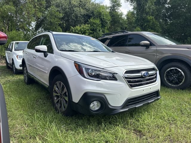 2018 Subaru Outback 3.6R Touring in Crystal White Pearl — front three-quarter view