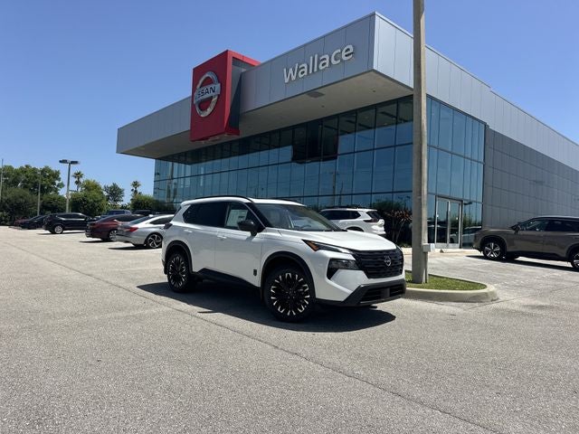 2026 Nissan Rogue Dark Armor in Everest White Pearl Tricoat — front three-quarter view
