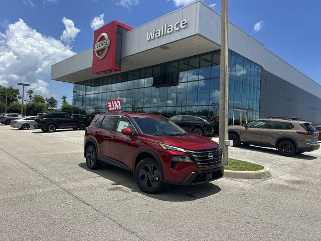 2026 Nissan Rogue SV in Scarlet Ember Tintcoat — front three-quarter view