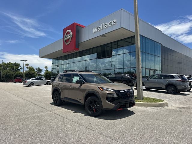 2026 Nissan Rogue Rock Creek in Baja Storm Metallic — front three-quarter view