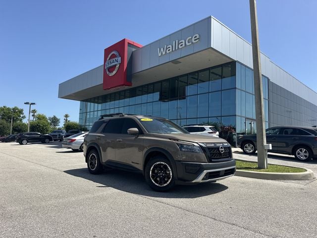 2023 Nissan Pathfinder Rock Creek in Baja Storm — front three-quarter view