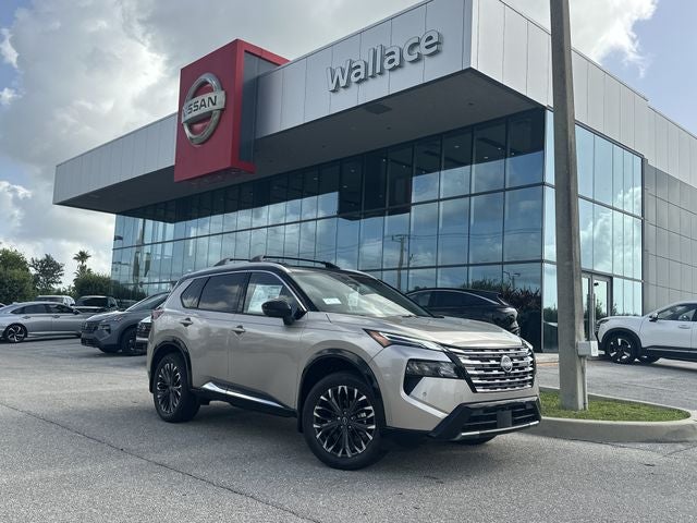 2026 Nissan Rogue Platinum in Champagne Silver/Black — front three-quarter view