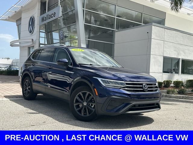 2024 Volkswagen Tiguan 2.0T SE in Atlantic Blue Metallic — front three-quarter view