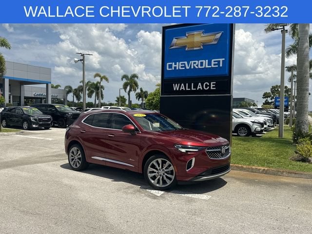 2022 Buick Envision Avenir in Cinnabar Metallic — front three-quarter view